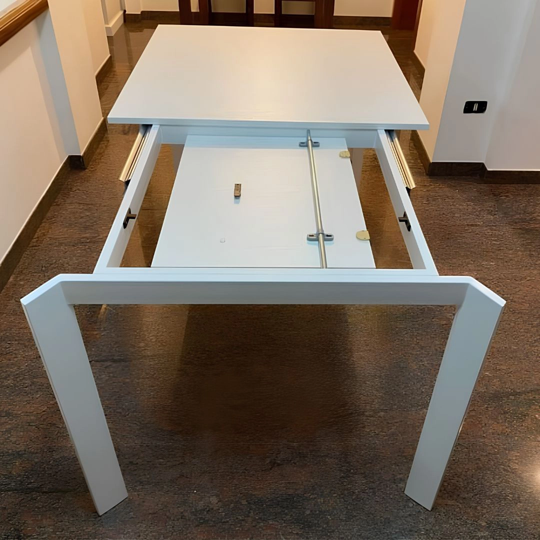 Tavolo allungabile moderno bianco con meccanismo e allunga interna Marca Design Shop