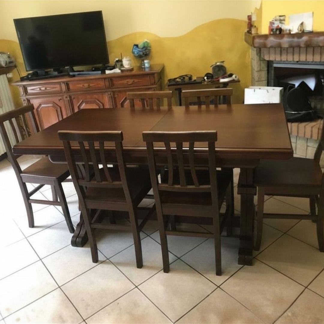 Vista d'insieme tavolo rettangolare in legno noce in ambiente living